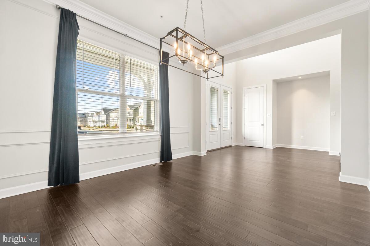 5521 Hawk Ridge Road Frederick, MD 21704 - Photo 10 of 66 a view of a room with wooden floor mirror and windows