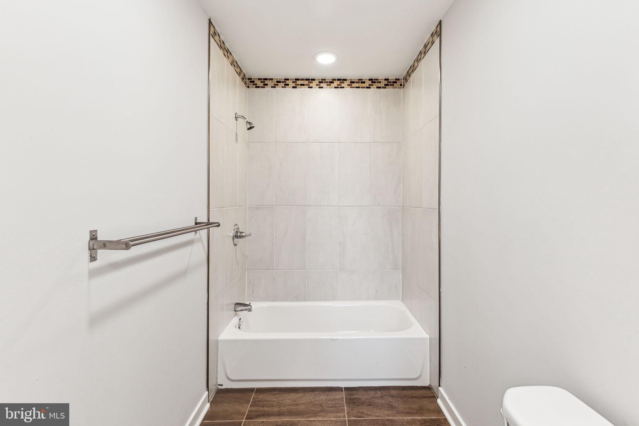 1418 Christian Street, Unit 1 Philadelphia, PA 19146 - Photo 12 of 28 a bathroom with a shower a bathtub and a shower