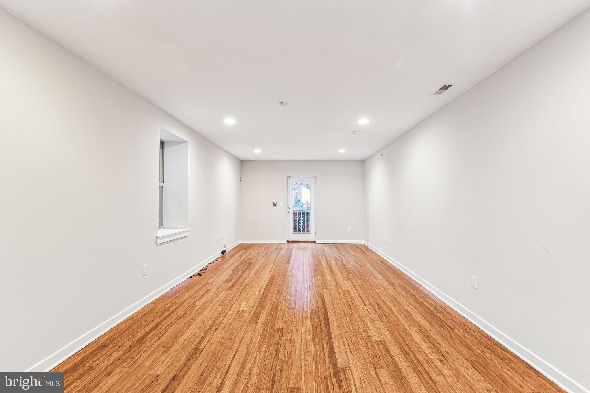 1418 Christian Street, Unit 1 Philadelphia, PA 19146 - Photo 14 of 28 a view of empty room with wooden floor