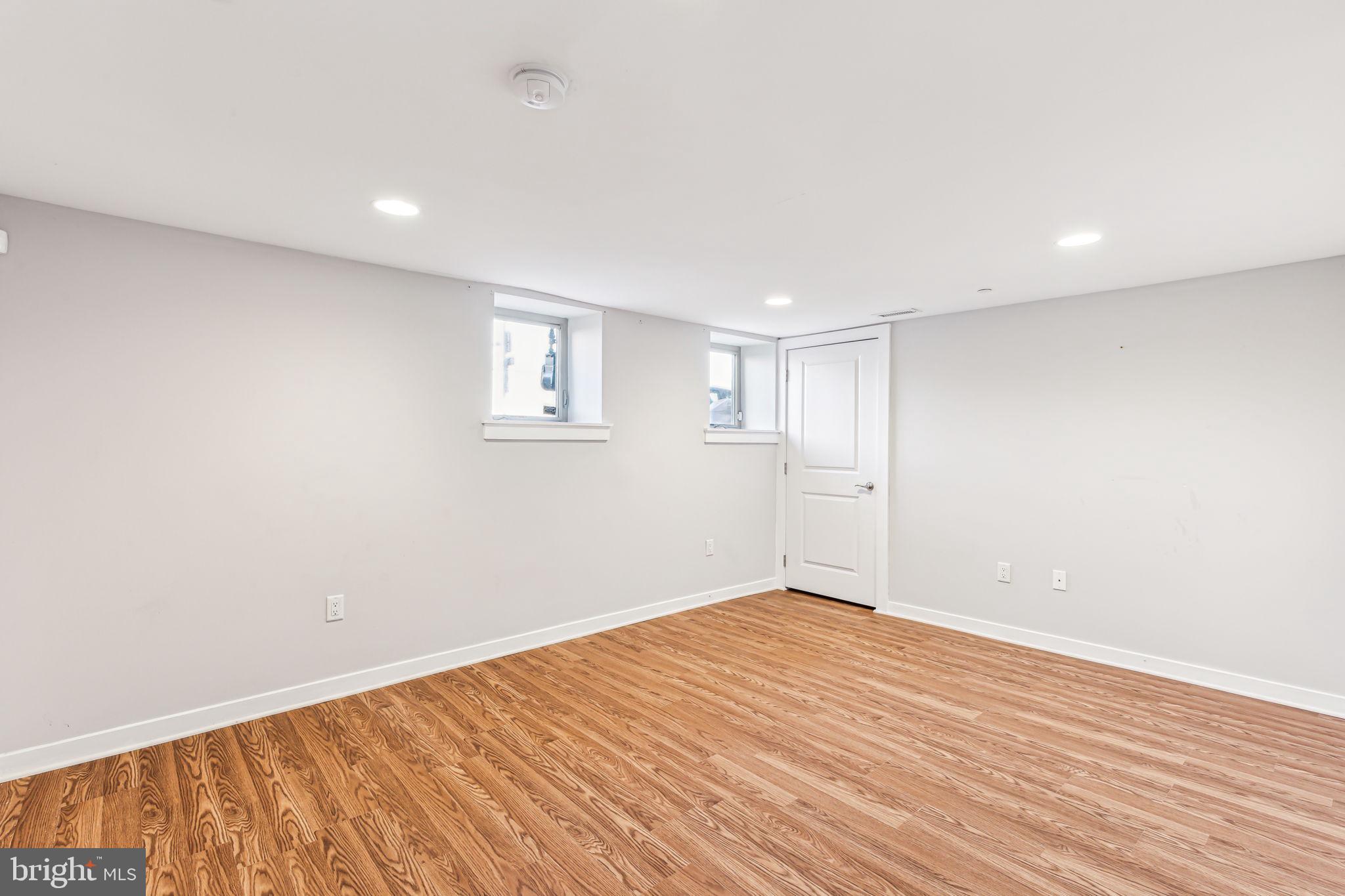 1418 Christian Street, Unit 1 Philadelphia, PA 19146 - Photo 18 of 28 a view of empty room with wooden floor and fan
