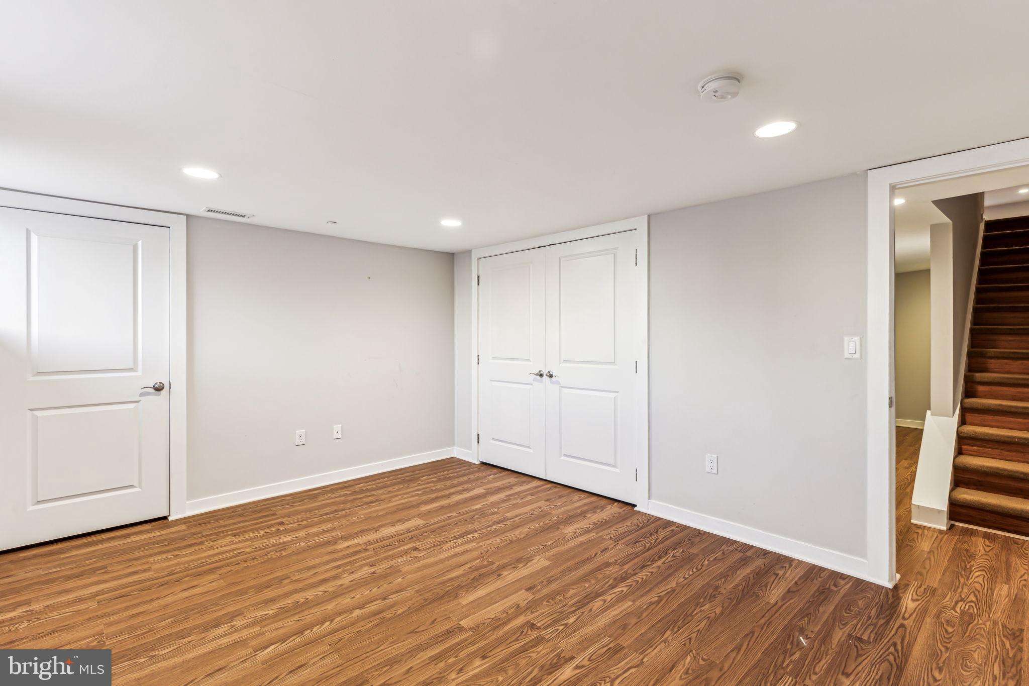 1418 Christian Street, Unit 1 Philadelphia, PA 19146 - Photo 19 of 28 a view of an empty room with wooden floor and closet
