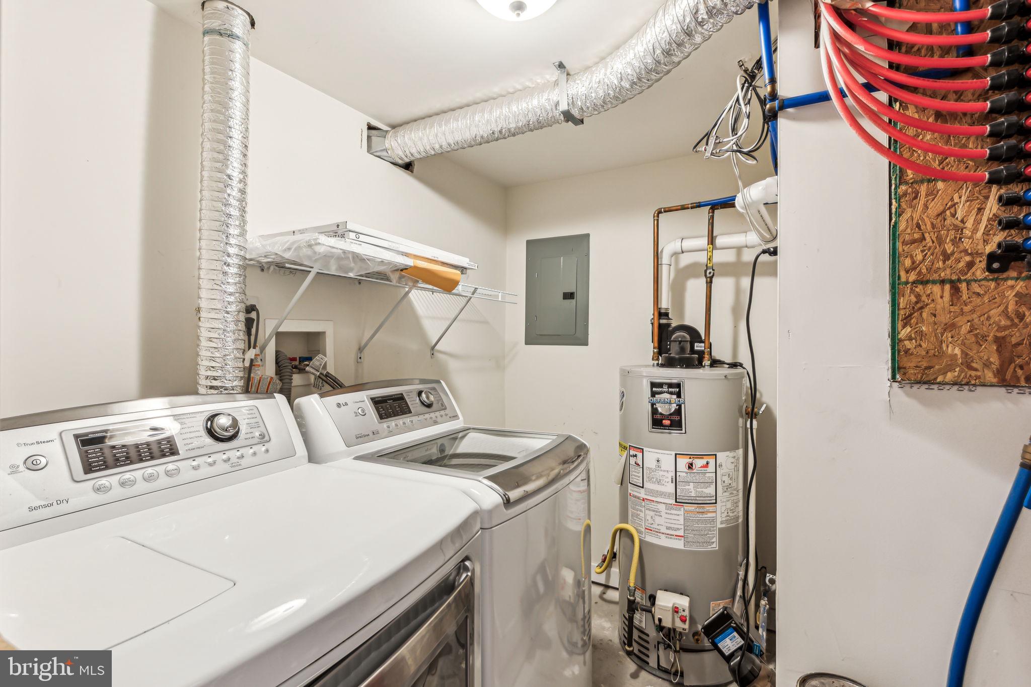 1418 Christian Street, Unit 1 Philadelphia, PA 19146 - Photo 22 of 28 a utility room with dryer and washer