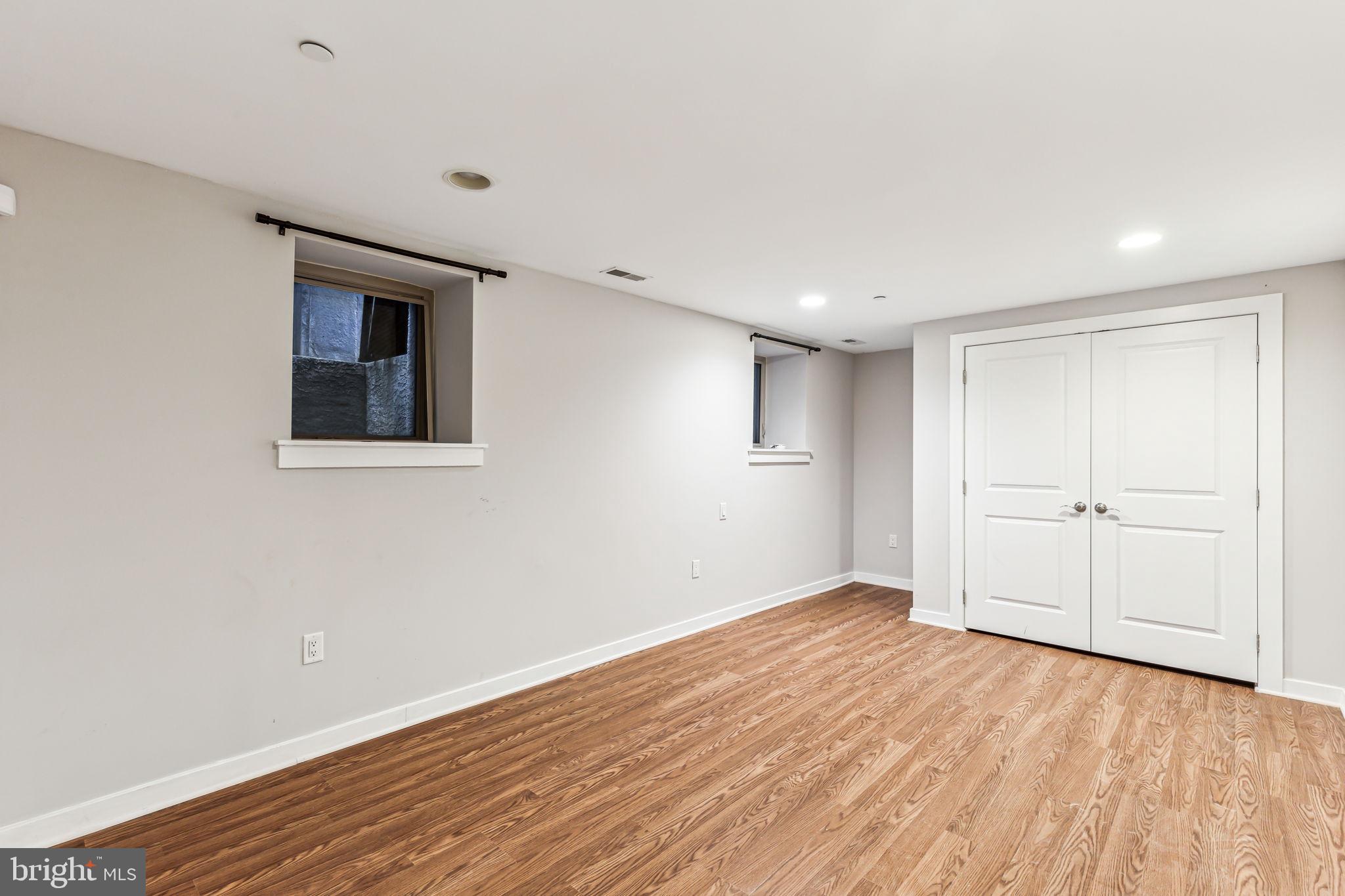 1418 Christian Street, Unit 1 Philadelphia, PA 19146 - Photo 24 of 28 a view of an empty room with wooden floor