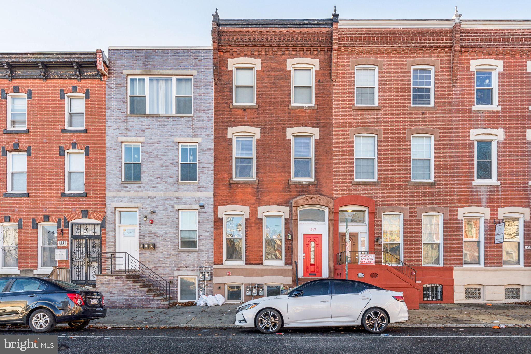 1418 Christian Street, Unit 1 Philadelphia, PA 19146 - Photo 26 of 28 a car parked in front of a building