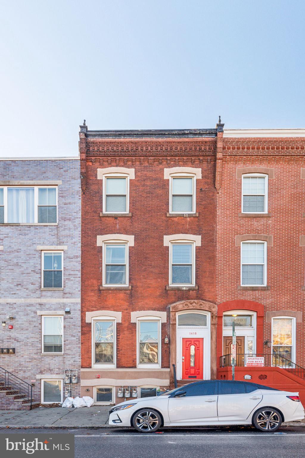 1418 Christian Street, Unit 1 Philadelphia, PA 19146 - Photo 27 of 28 a front view of a building with parking