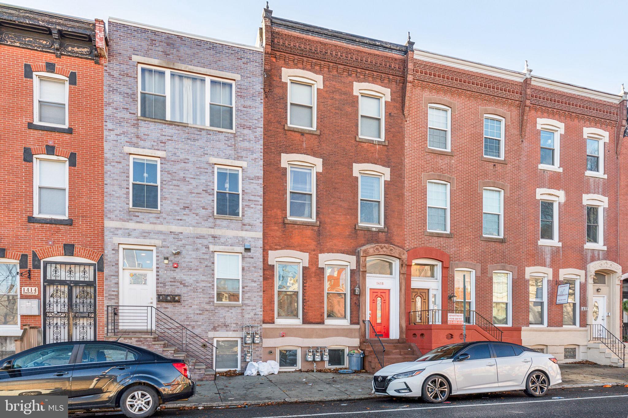 1418 Christian Street, Unit 1 Philadelphia, PA 19146 - Photo 28 of 28 a front view of a building with parking space