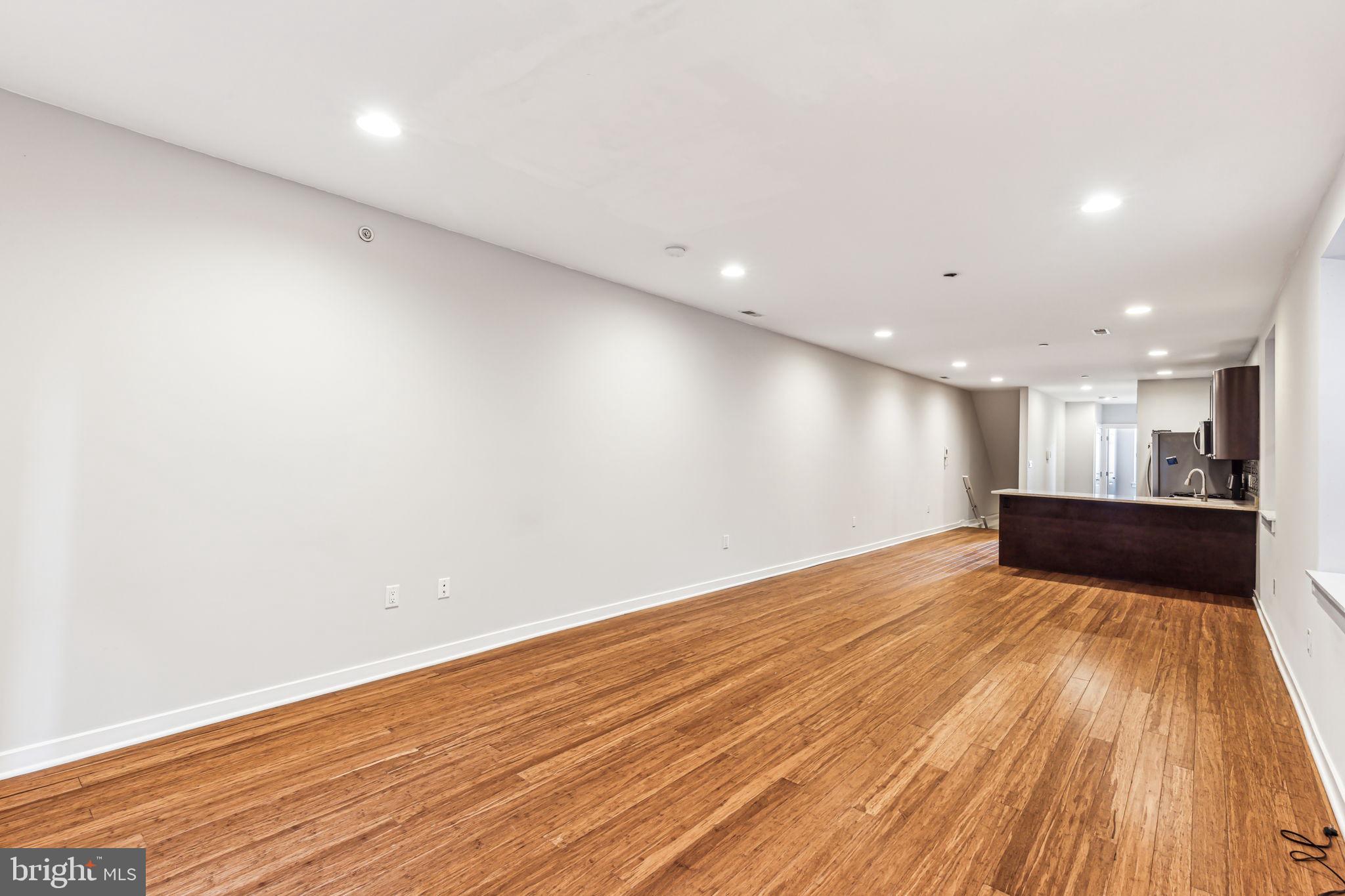 1418 Christian Street, Unit 1 Philadelphia, PA 19146 - Photo 4 of 28 a view of empty room with wooden floor