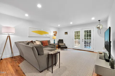 a large white kitchen with cabinets a counter space a sink and appliances