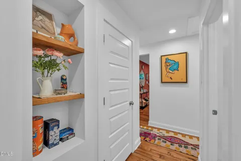 a living room with furniture and a ceiling fan