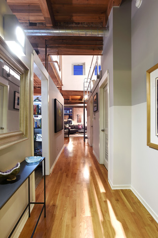 333 South Desplaines Street, Unit 704 Chicago, IL 60661 - Photo 16 of 21 a view of a hallway with wooden floor and staircase