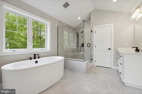 a bathroom with a granite countertop sink mirror and double