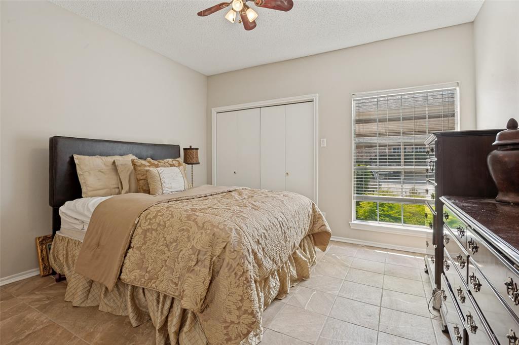 14277 Preston Road, Unit 1012 Dallas, TX 75254 - Photo 5 of 13 Primary bedroom with two spacious closets and ensuite bathroom