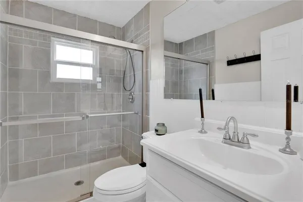 an aerial view of a house with garden space and street view