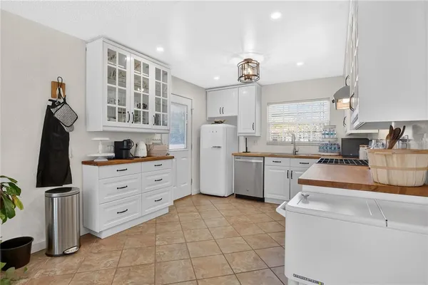 a kitchen with stainless steel appliances granite countertop a stove and cabinets