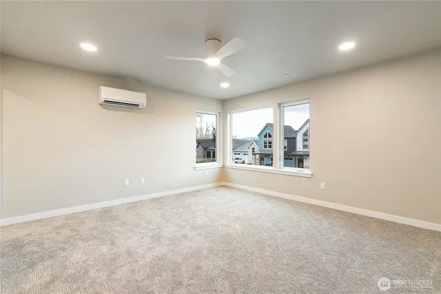 an empty room with windows and entrance