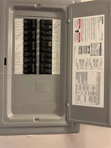 a kitchen with a refrigerator and a stove