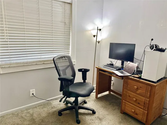 a close view of a refrigerator in kitchen and cabinets