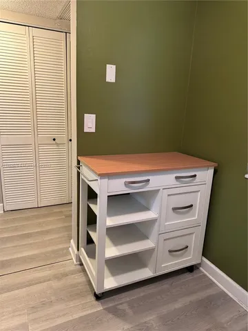 a view of a kitchen with a sink and a stove
