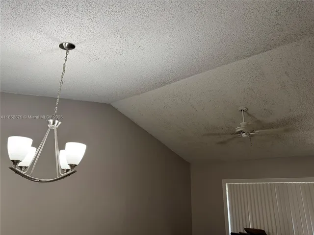 a view of room with window and entryway