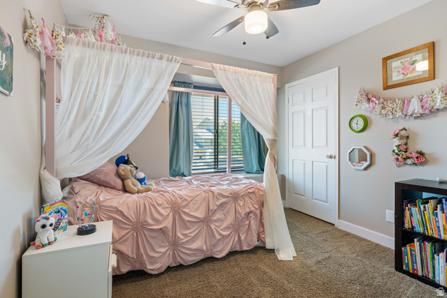 790 East Fiddlers Canyon Road Cedar City, UT 84721 - Photo 18 of 35 Carpeted room featuring a ceiling fan with integrated lighting, a white six-panel door, and a window with blinds and blue drapery