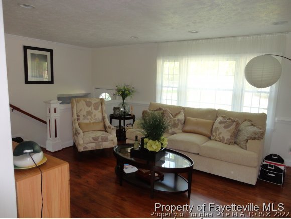 1013 Myra Road Raeford, NC 28376 - Photo 11 of 25 a living room with furniture a rug and a window