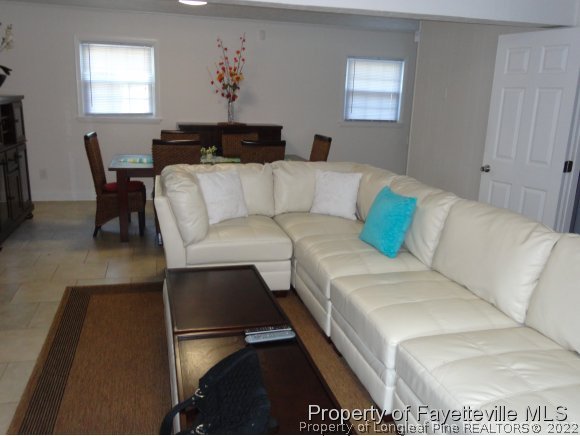 1013 Myra Road Raeford, NC 28376 - Photo 15 of 25 a living room with furniture and a potted plant