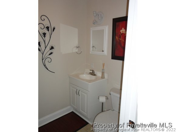 1013 Myra Road Raeford, NC 28376 - Photo 17 of 25 a bathroom with a sink a toilet and shower