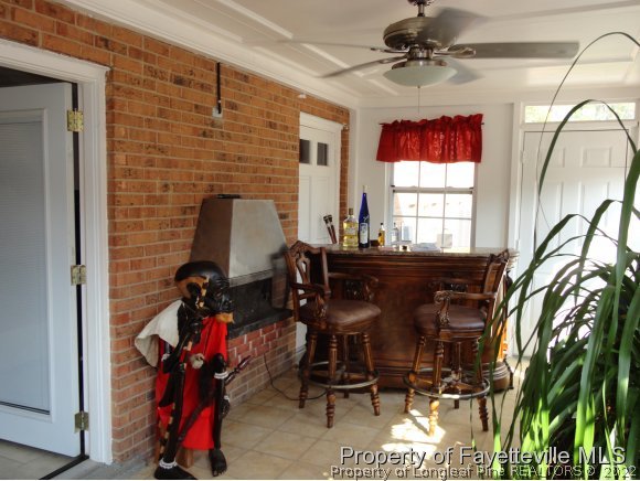 1013 Myra Road Raeford, NC 28376 - Photo 19 of 25 a view of a workspace with furniture and a potted plant