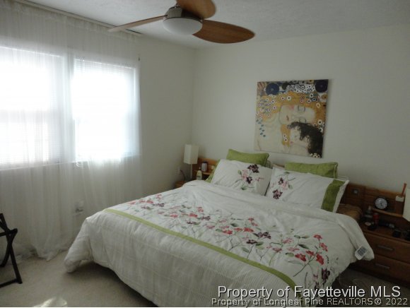 1013 Myra Road Raeford, NC 28376 - Photo 20 of 25 a bedroom with a bed and a window