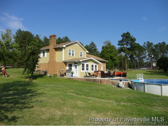 1013 Myra Road Raeford, NC 28376 - Photo 2 of 25 a front view of a house with garden