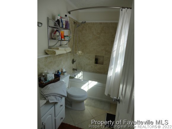 1013 Myra Road Raeford, NC 28376 - Photo 21 of 25 a bathroom with a sink and a toilet