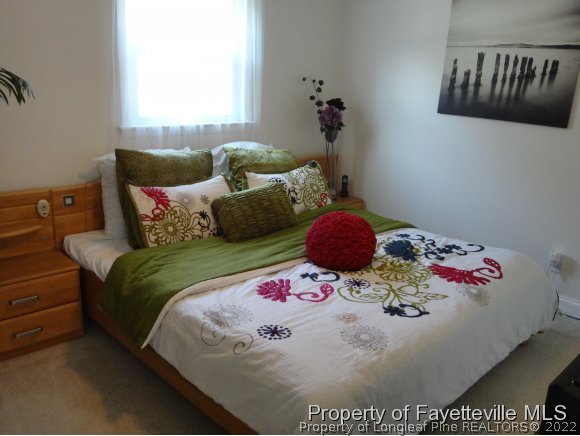 1013 Myra Road Raeford, NC 28376 - Photo 22 of 25 a bedroom with a bed and dresser