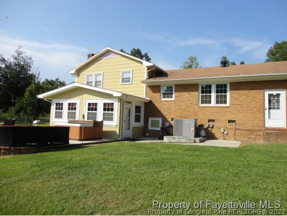 1013 Myra Road Raeford, NC 28376 - Photo 3 of 25 a front view of a house with a yard and porch
