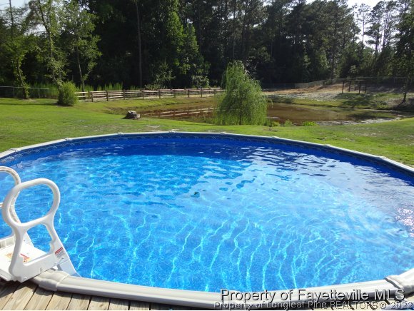 1013 Myra Road Raeford, NC 28376 - Photo 4 of 25 a view of swimming pool with a yard