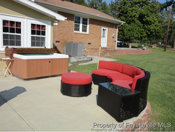 1013 Myra Road Raeford, NC 28376 - Photo 5 of 25 a view of a chairs and table in backyard of the house