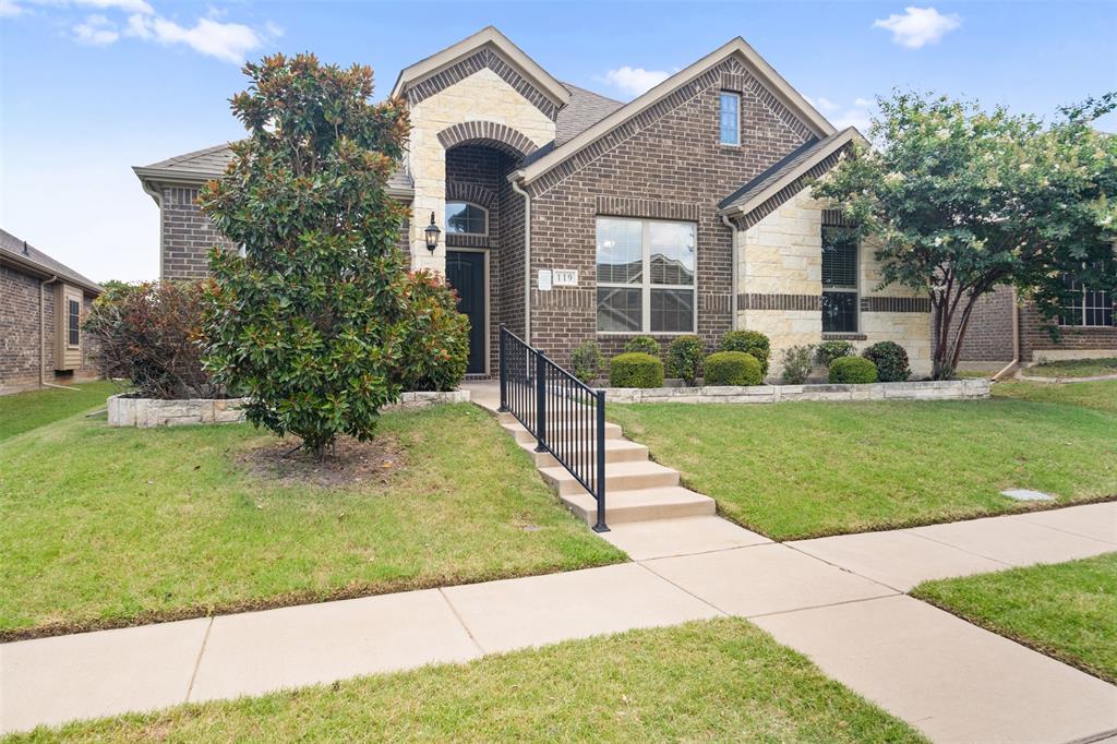 119 Happy Lane Red Oak, TX 75154 - Photo 3 of 37 Traditional-style exterior showcasing a brick and stone facade