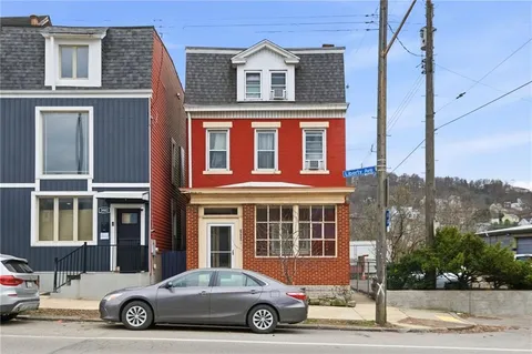 a car parked in front of a house