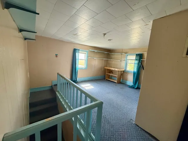 a view of livingroom with furniture and windows