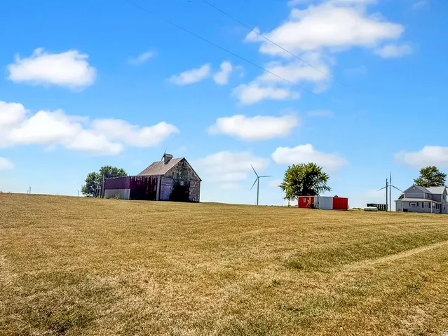 a view of a large body of water with a building in the background