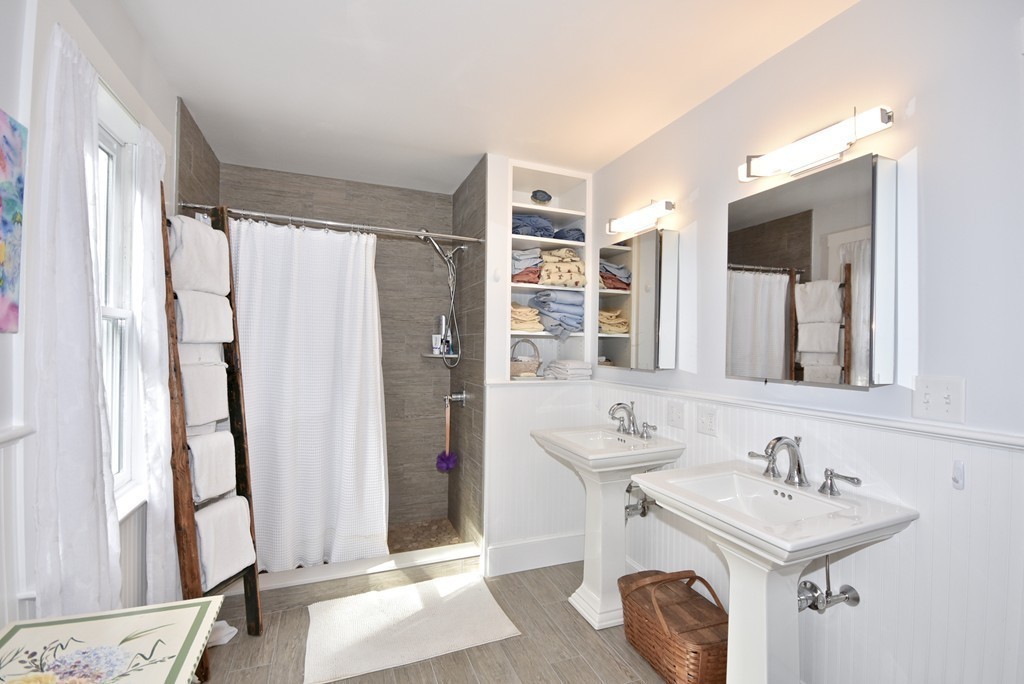 193 High Street Rochester, MA 02770 - Photo 13 of 25 a bathroom with a sink and a mirror