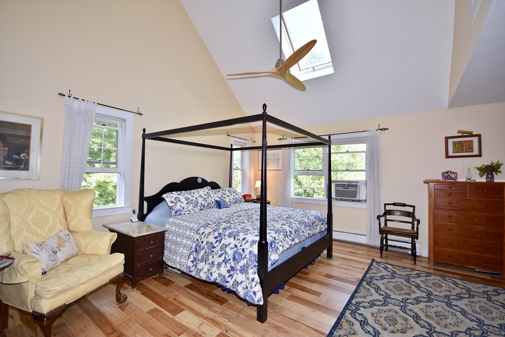 193 High Street Rochester, MA 02770 - Photo 16 of 25 a bedroom with a bed a couch and dresser