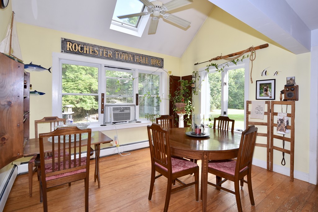 193 High Street Rochester, MA 02770 - Photo 8 of 25 a dining room with furniture a chandelier and wooden floor