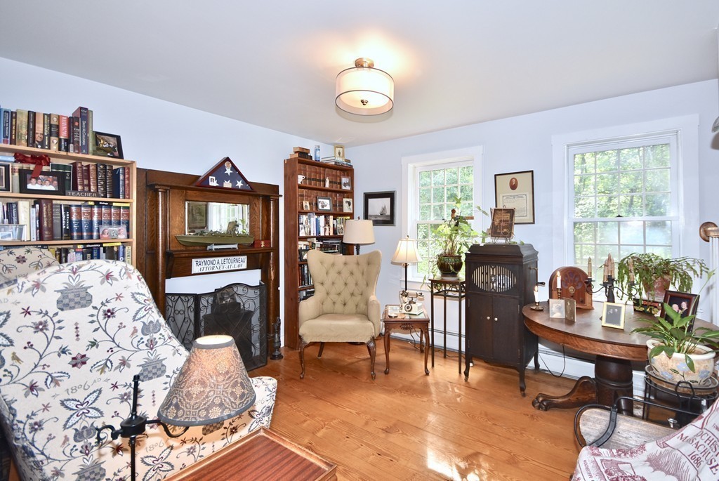 193 High Street Rochester, MA 02770 - Photo 9 of 25 a living room with furniture a bookshelf and a window