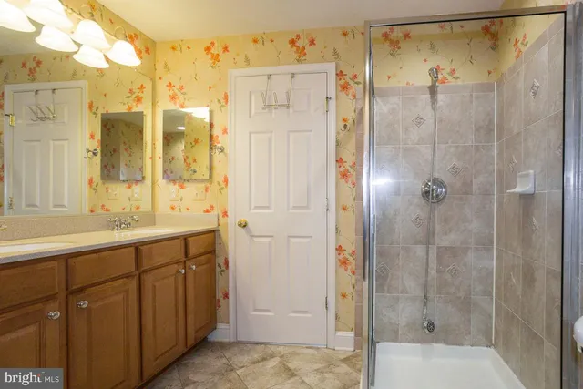 a bathroom with a toilet and a shower curtain