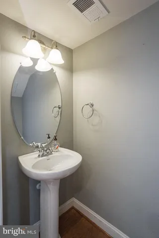 a couple of cars parked in front of a building