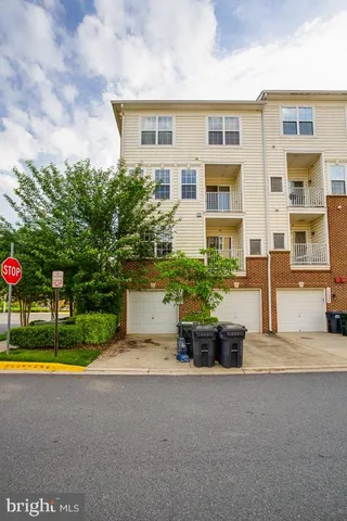 a view of building with yard and outdoor space