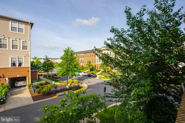 a view of a parked cars in front of a building