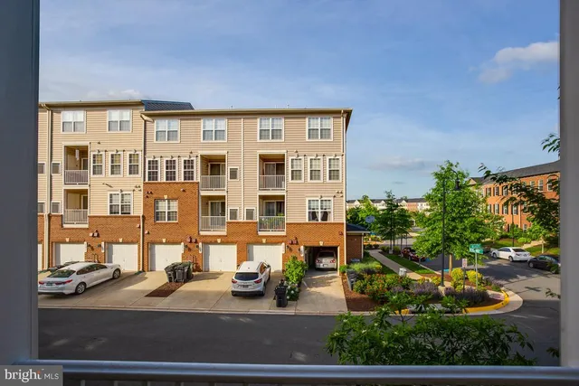 a view of a house with a yard and plants