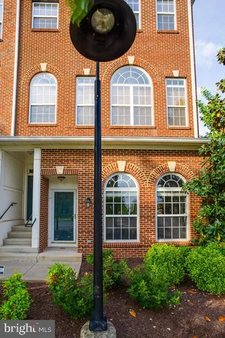 front view of a brick house with a large windows