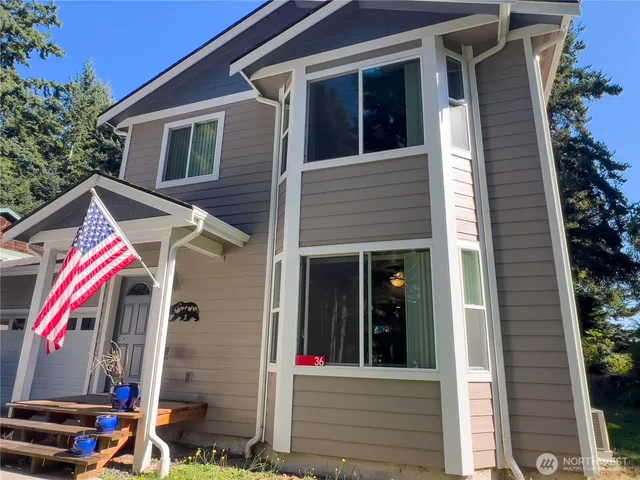 a view of a house with a door and wooden walls